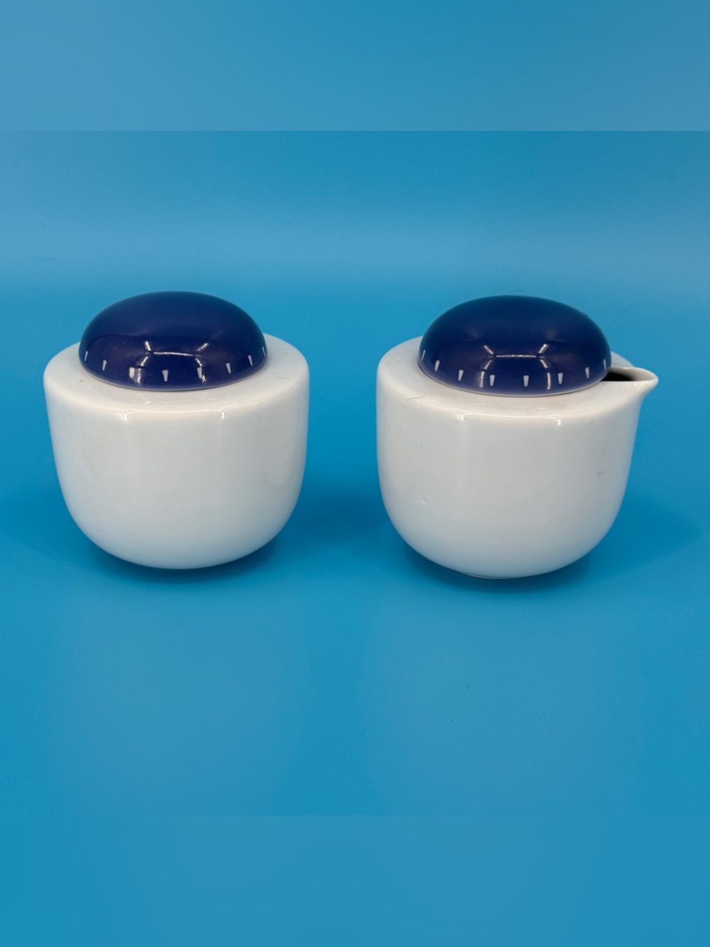 Dansk White Ceramic Sugar and Creamer Set with Dark Blue Lids